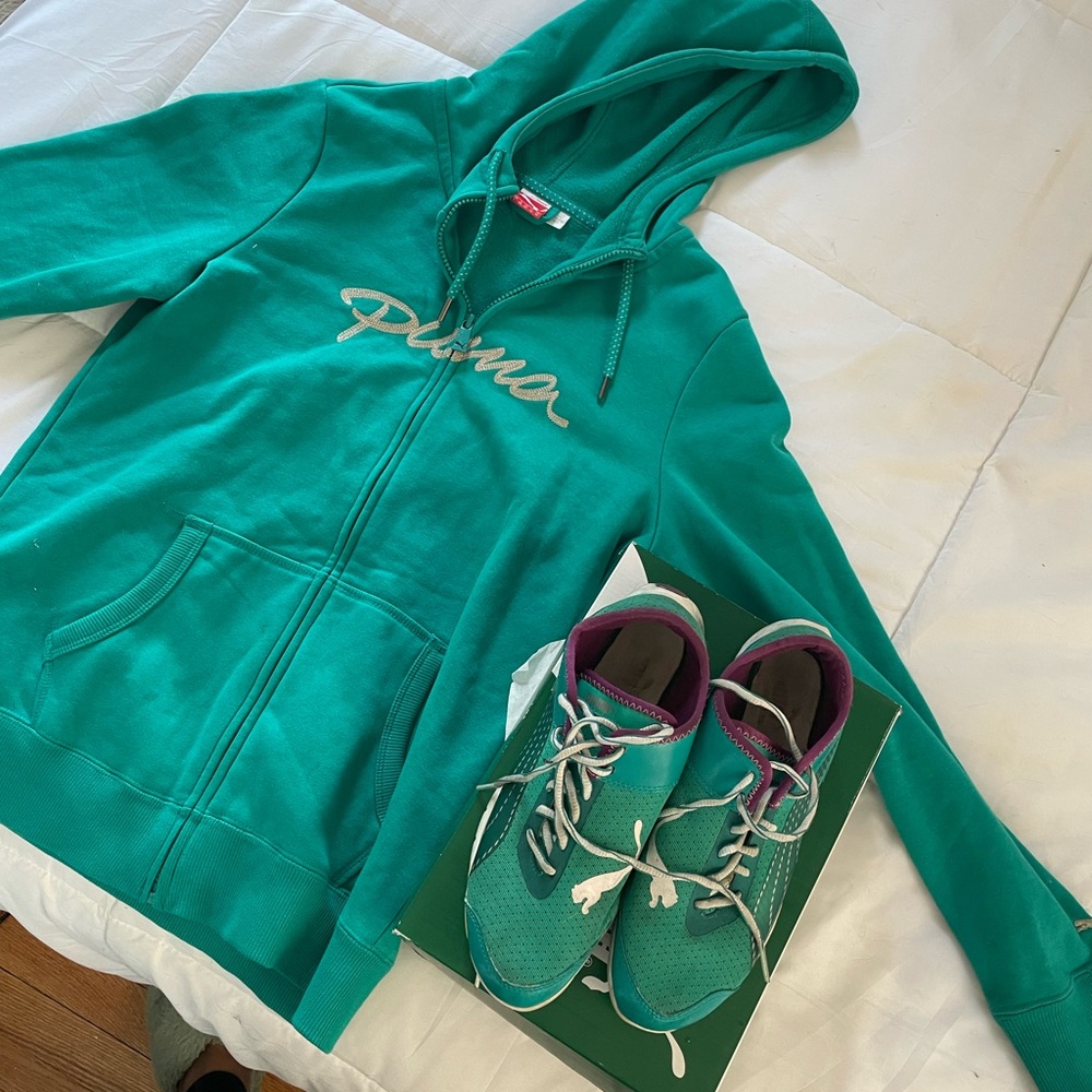 Turquoise Puma hoodie and gym shoes